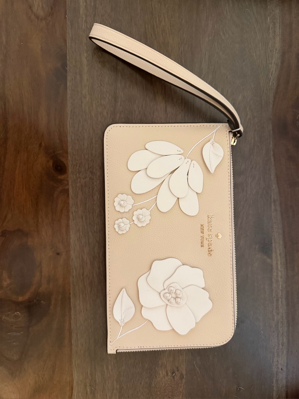 Kate Spade New York Lucy Floral Wristlet in milk glass pebbled leather
